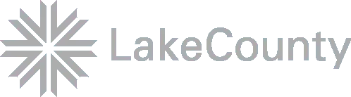 LakeCounty logo featuring a gray starburst symbol composed of eight arrows pointing inwards.